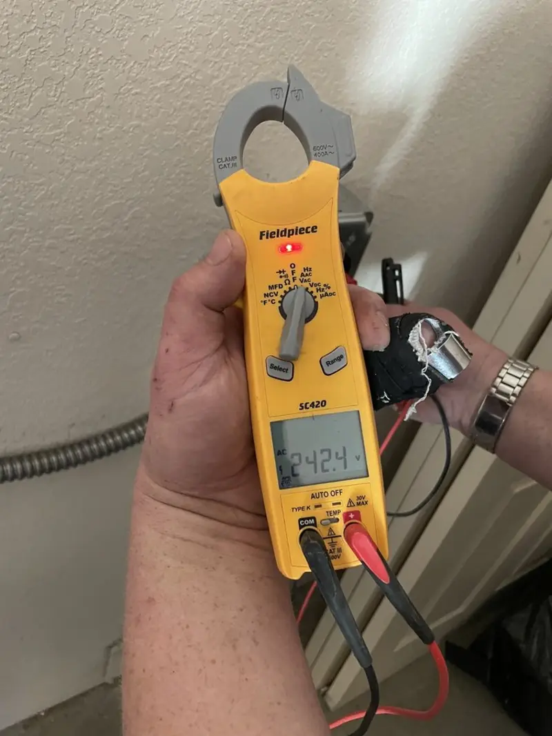 Voltage testing with clamp meter during Circuit Breaker Repair in Oakwood